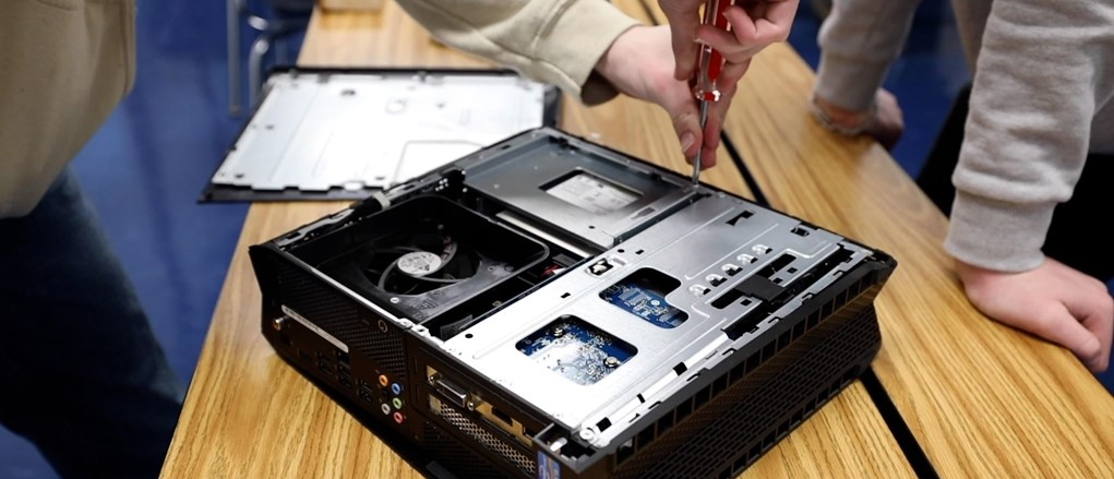 Information technology student working on computer