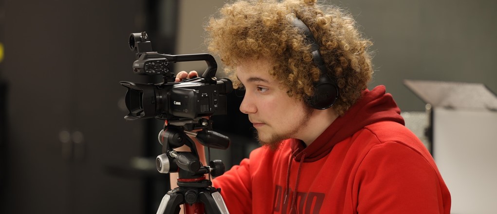 ITM student using a video camera